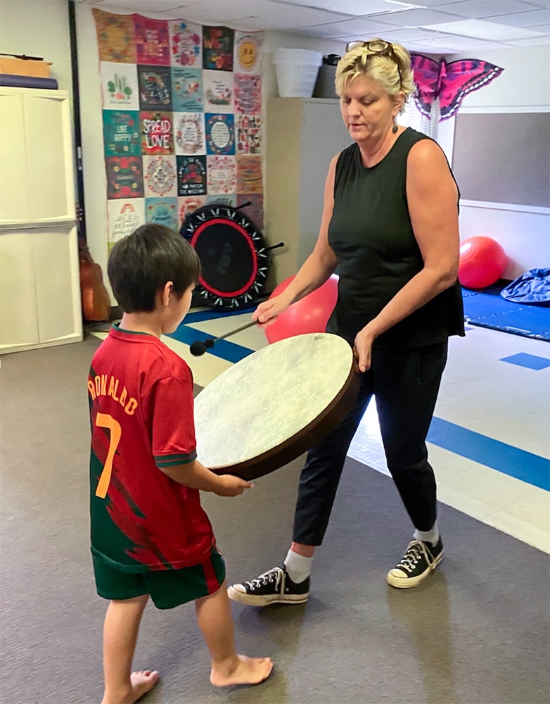 Everest receiving rhythmic motor input during an NMT session